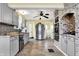Bright kitchen features stainless steel appliances, ample gray cabinetry, and a brick feature oven that adds rustic elegance at 429 E Main St, Whiteland, IN 46184