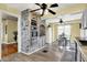 Spacious kitchen and dining area with stainless steel appliances, a unique brick oven feature, and charming breakfast nook at 429 E Main St, Whiteland, IN 46184