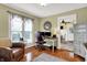Inviting home office with a large window, comfortable seating, and hardwood floors perfect for a productive workspace at 429 E Main St, Whiteland, IN 46184