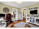 Comfortable home office with natural light, desk space, and seamless entry to the living spaces at 429 E Main St, Whiteland, IN 46184