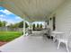 Inviting porch featuring comfortable seating and a porch swing with well-maintained landscaping at 429 E Main St, Whiteland, IN 46184