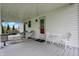 Covered porch with seating, rug and a swing, ideal for relaxation at 429 E Main St, Whiteland, IN 46184