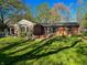 Brick home with a well-manicured lawn and a blue door at 4305 Lincoln Rd, Indianapolis, IN 46228
