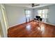Bright spare bedroom offering hardwood floors, clean neutral-toned walls, and a large window at 4305 Lincoln Rd, Indianapolis, IN 46228