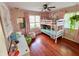 ' bedroom with wood floors, natural light, bunk beds, and fun decor at 4305 Lincoln Rd, Indianapolis, IN 46228