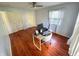 Bright bedroom featuring wood floors, white trim and a ceiling fan at 4305 Lincoln Rd, Indianapolis, IN 46228