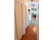Inviting hallway with hardwood floors and neutral walls, leading to various rooms in the house at 4305 Lincoln Rd, Indianapolis, IN 46228