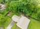 Aerial view of a home with a large, fenced backyard, complete with mature trees and a patio at 4904 Kessler Blvd N Dr, Indianapolis, IN 46228