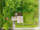 An aerial view shows a well-maintained property with mature trees and a manicured lawn at 4904 Kessler Blvd N Dr, Indianapolis, IN 46228