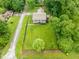 Aerial view showcases this property's large lot, fenced yard, and mature landscaping at 4904 Kessler Blvd N Dr, Indianapolis, IN 46228
