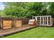 Backyard showcasing a chicken coop, composting bins, and ample space for outdoor activities at 4904 Kessler Blvd N Dr, Indianapolis, IN 46228
