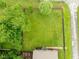 Aerial view featuring a large, green backyard with manicured lawn and mature trees at 4904 Kessler Blvd N Dr, Indianapolis, IN 46228