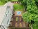 The backyard features a patio area, raised garden beds, and a lush lawn, perfect for outdoor entertaining at 4904 Kessler Blvd N Dr, Indianapolis, IN 46228
