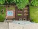 Aerial view highlighting a brick patio with furniture and a well-maintained garden area in the backyard at 4904 Kessler Blvd N Dr, Indianapolis, IN 46228