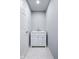 Clean and bright powder room with a modern white vanity and tiled floor at 4904 Kessler Blvd N Dr, Indianapolis, IN 46228