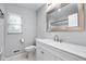 Bright bathroom with a vanity sink and a large mirror at 4904 Kessler Blvd N Dr, Indianapolis, IN 46228