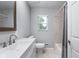 Well-lit bathroom features a modern vanity and a tiled walk-in shower at 4904 Kessler Blvd N Dr, Indianapolis, IN 46228