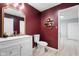 Charming bathroom with white vanity, large mirror, and decorative accents at 4904 Kessler Blvd N Dr, Indianapolis, IN 46228
