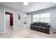 Spacious bonus room featuring light wood floors, neutral walls, and access to other rooms at 4904 Kessler Blvd N Dr, Indianapolis, IN 46228