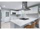 Bright kitchen featuring white cabinets, stainless appliances and a large island with seating at 4904 Kessler Blvd N Dr, Indianapolis, IN 46228