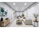 Cozy finished basement living room with recessed lights, modern decor, and neutral walls at 4904 Kessler Blvd N Dr, Indianapolis, IN 46228