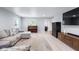 Bright living area with a sectional sofa, piano, and plenty of space at 4904 Kessler Blvd N Dr, Indianapolis, IN 46228