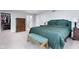 Spacious bedroom featuring a green bed set and an open closet at 4904 Kessler Blvd N Dr, Indianapolis, IN 46228