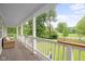 Spacious porch offering stunning views of the lush green surroundings at 4904 Kessler Blvd N Dr, Indianapolis, IN 46228