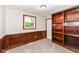 Bedroom with carpet, neutral walls, built in bookcase, and natural light for a cozy and peaceful retreat at 5141 Annette St, Indianapolis, IN 46208