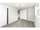 Bedroom with carpet and white closets, offering ample space for organization and storage of belongings at 5141 Annette St, Indianapolis, IN 46208