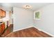 Bright dining area with hardwood floors and a view to the adjacent kitchen for easy meal service at 5141 Annette St, Indianapolis, IN 46208