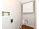 Laundry room with hook-ups, overhead cabinets, and wood-look flooring at 5141 Annette St, Indianapolis, IN 46208