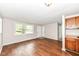 Inviting living room featuring wood-look floors, natural light, and an open floor plan at 5141 Annette St, Indianapolis, IN 46208