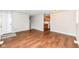 Bright living room featuring wood-look floors and an open layout to the kitchen at 5141 Annette St, Indianapolis, IN 46208