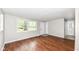 Bright living room with wood-look floors, offering an inviting and open living space at 5141 Annette St, Indianapolis, IN 46208