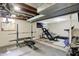 Spacious basement gym with weightlifting equipment and ample workout space at 5341 Armstrong Dr, Indianapolis, IN 46237