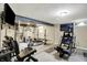 Well-equipped basement gym featuring a variety of workout equipment and a motivational poster at 5341 Armstrong Dr, Indianapolis, IN 46237