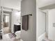 Bathroom featuring vanity, toilet, and bath tub with glass doors at 5341 Armstrong Dr, Indianapolis, IN 46237