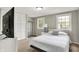 Bedroom featuring large windows, closet, and a bed with nightstand at 5341 Armstrong Dr, Indianapolis, IN 46237