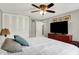 Bedroom with a bed, dresser with TV, and a closet with white doors at 5341 Armstrong Dr, Indianapolis, IN 46237