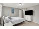 Bedroom featuring large windows, closet, and a bed with nightstand at 5341 Armstrong Dr, Indianapolis, IN 46237