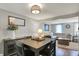 Inviting dining area features modern lighting, stylish furnishings, and seamless transition into the comfortable living room at 5341 Armstrong Dr, Indianapolis, IN 46237