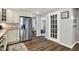 Modern kitchen flows into a comfortable living area, featuring stainless appliances and seamless transition between spaces at 5341 Armstrong Dr, Indianapolis, IN 46237