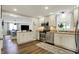 Well-lit kitchen boasts stainless appliances, ample counter space, and convenient access to the adjacent dining area at 5341 Armstrong Dr, Indianapolis, IN 46237