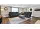 Cozy living room features comfortable seating, a stylish area rug, and a serene atmosphere, ideal for relaxation and leisure at 5341 Armstrong Dr, Indianapolis, IN 46237