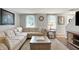 Cozy living room with a large sectional, wood coffee table, and plenty of natural light at 5341 Armstrong Dr, Indianapolis, IN 46237