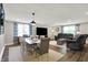 Open-concept living area features a dining table, comfortable seating, and bright natural light, ideal for Gathering gatherings at 5341 Armstrong Dr, Indianapolis, IN 46237
