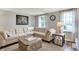 Bright living room features a comfortable sectional sofa, wood accents, and stylish decor at 5341 Armstrong Dr, Indianapolis, IN 46237