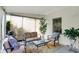 Relaxing screened porch featuring comfortable seating and decorative plants at 5341 Armstrong Dr, Indianapolis, IN 46237
