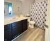 Bathroom with a modern vanity, toilet, and patterned shower curtain, offering a cozy and functional space at , McCordsville, IN 46055